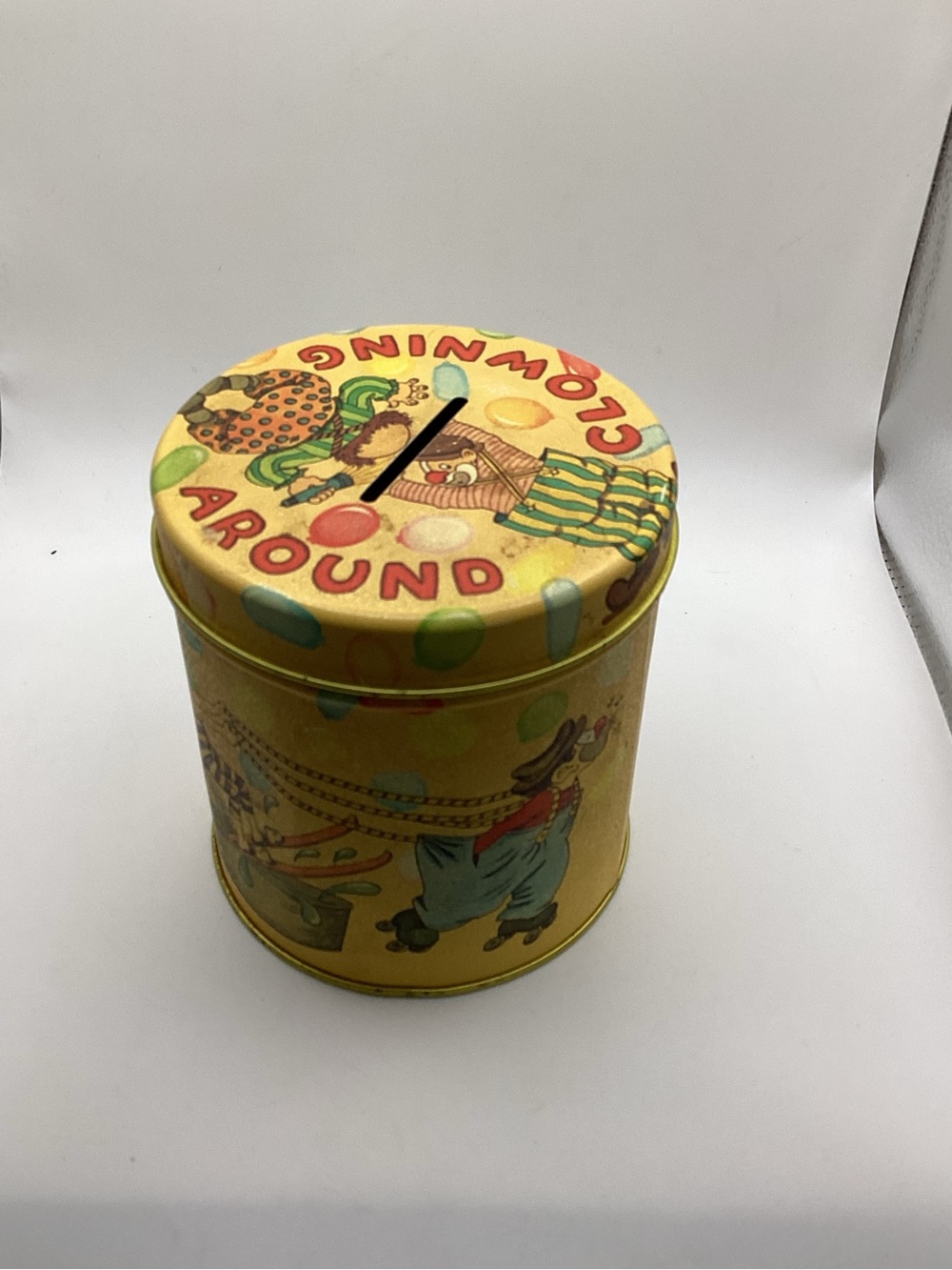 Yellow Clown-Themed Tin Coin Bank